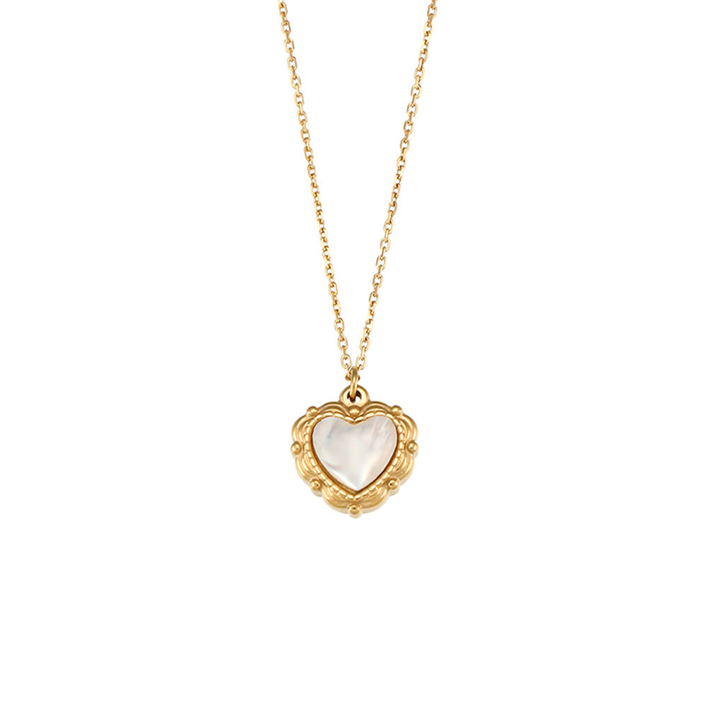 Close-up of the shell heart pendant and gold chain